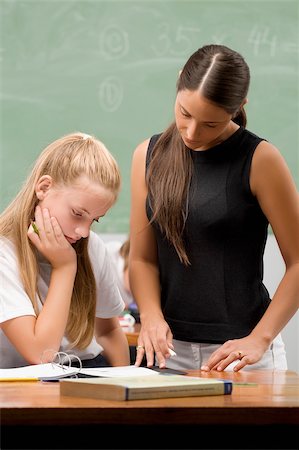 simsearch:614-06895765,k - Female teacher teaching a schoolgirl in a classroom Stock Photo - Premium Royalty-Free, Code: 625-02932596
