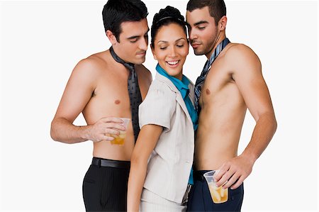 fantasy (sexual) - Side profile of a businesswoman standing between two businessmen with disposable cups Stock Photo - Premium Royalty-Free, Code: 625-02932601