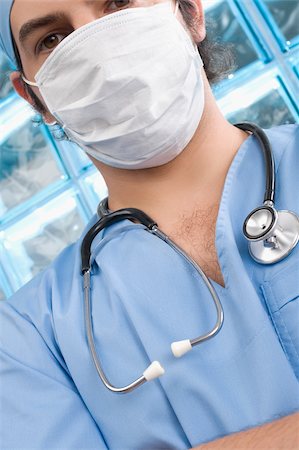 simsearch:625-02929180,k - Portrait of a male surgeon wearing a surgical mask Stock Photo - Premium Royalty-Free, Code: 625-02932734