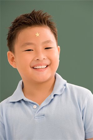 Portrait of a boy smiling Stock Photo - Premium Royalty-Free, Code: 625-02933077