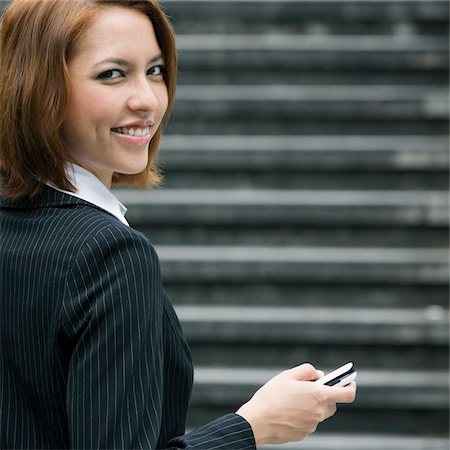 simsearch:625-02931998,k - Portrait of a businesswoman text messaging Stock Photo - Premium Royalty-Free, Code: 625-02933159