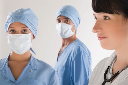 simsearch:625-02929180,k - Female doctor with two surgeons Stock Photo - Premium Royalty-Free, Code: 625-02933177