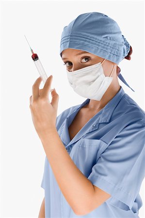 simsearch:625-02929180,k - Portrait of a female surgeon holding a syringe Stock Photo - Premium Royalty-Free, Code: 625-02933257