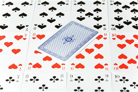 playing cards - Row of playing cards with on card upside down Stock Photo - Premium Royalty-Free, Code: 628-05817360