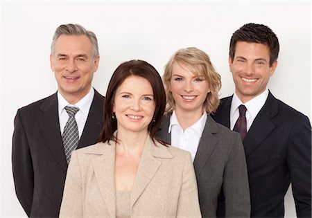 Four smiling business people Stock Photo - Premium Royalty-Free, Code: 628-05817494