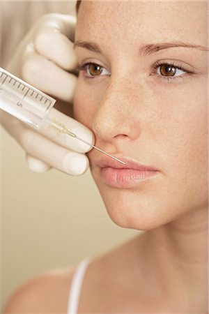 perfect body woman - Woman having injection in lip Stock Photo - Premium Royalty-Free, Code: 628-05817742