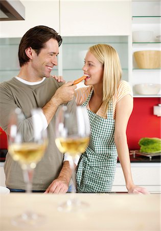 Couple flirting in a kitchen Stock Photo - Premium Royalty-Free, Code: 628-05817756