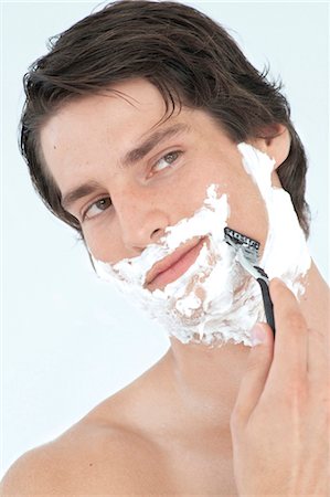 simsearch:628-05817544,k - Young man shaving Stock Photo - Premium Royalty-Free, Code: 628-05817751
