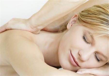 Blond teenage girl receiving massage Stock Photo - Premium Royalty-Free, Code: 628-05817817