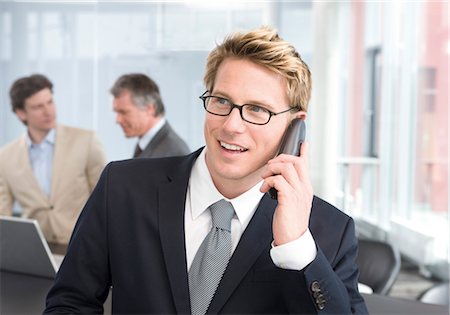 Businessman on the phone in office Stock Photo - Premium Royalty-Free, Code: 628-05817965