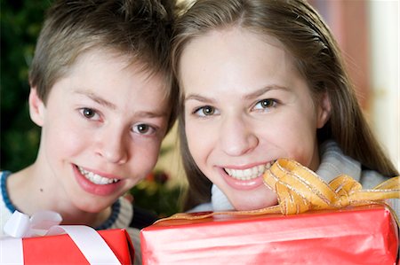Happy brother and sister with Christmas presents, Munich, Bavaria, Germany Stock Photo - Premium Royalty-Free, Code: 628-05818128