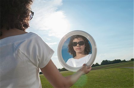 simsearch:628-07072097,k - Girl outdoors holding mirror Stock Photo - Premium Royalty-Free, Code: 628-07072098