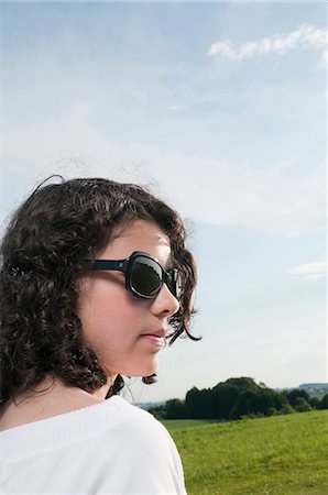 simsearch:628-07072097,k - Dark-haired girl outdoors wearing sunglasses Stock Photo - Premium Royalty-Free, Code: 628-07072103