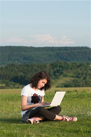 simsearch:628-07072097,k - Girl using laptop in meadow Stock Photo - Premium Royalty-Free, Code: 628-07072116