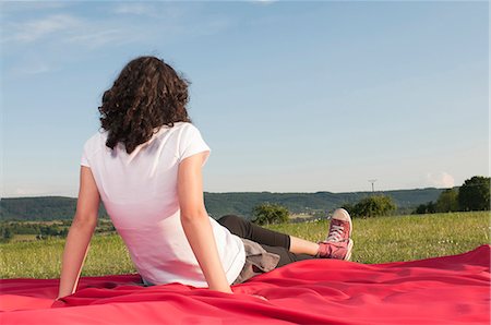 simsearch:700-08743683,k - Girl sitting on blanket in meadow Stock Photo - Premium Royalty-Free, Code: 628-07072110
