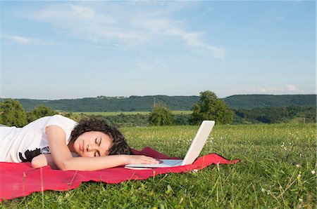 simsearch:628-07072884,k - Girl with laptop sleeping in meadow Stock Photo - Premium Royalty-Free, Code: 628-07072113