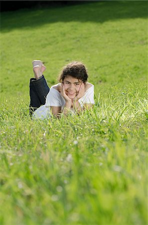 simsearch:628-07072097,k - Smiling girl lying in meadow Stock Photo - Premium Royalty-Free, Code: 628-07072127