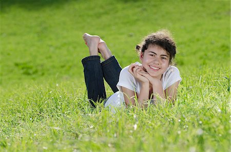 simsearch:628-07072097,k - Smiling girl lying in meadow Stock Photo - Premium Royalty-Free, Code: 628-07072128