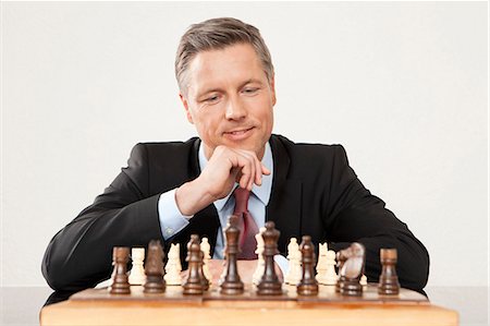 simsearch:614-06897440,k - Businessman playing chess Stock Photo - Premium Royalty-Free, Code: 628-07072219