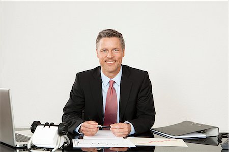 director - Smiling manager sitting at desk Stock Photo - Premium Royalty-Free, Code: 628-07072212
