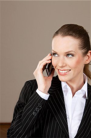 simsearch:628-07072621,k - Smiling businesswoman on the phone Stock Photo - Premium Royalty-Free, Code: 628-07072255