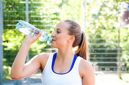 simsearch:628-05817723,k - Teenage girl drinking from water bottle Stock Photo - Premium Royalty-Free, Code: 628-07072466