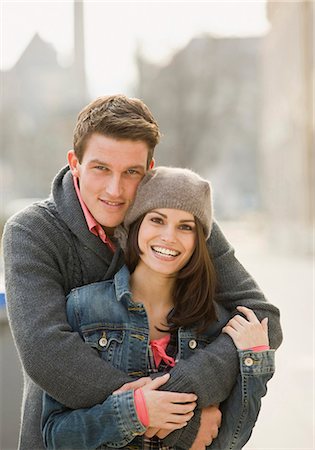 simsearch:628-07072621,k - Happy young couple embracing outdoors Stock Photo - Premium Royalty-Free, Code: 628-07072514