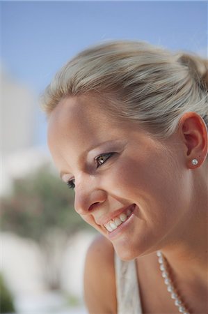 simsearch:628-07072621,k - Smiling blond woman outdoors Stock Photo - Premium Royalty-Free, Code: 628-07072626