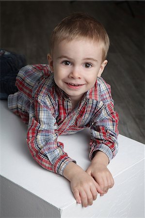 Smiling blond boy wearing checkered shirt Stock Photo - Premium Royalty-Free, Code: 628-07072671