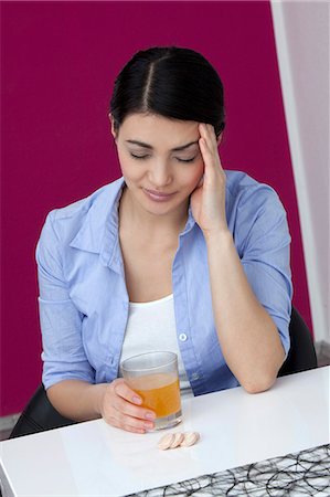 simsearch:628-07072884,k - Young woman sitting at table with drink and tablets Stock Photo - Premium Royalty-Free, Code: 628-07072835