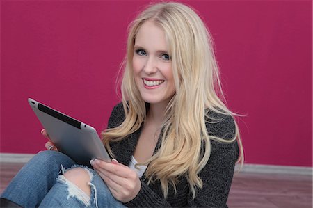 simsearch:628-07072884,k - Happy young woman using tablet computer Stock Photo - Premium Royalty-Free, Code: 628-07072960
