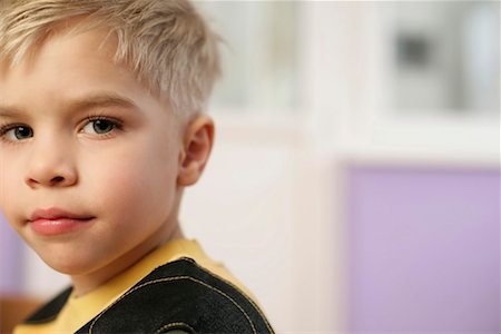 Little boy looking at camera, portrait Stock Photo - Premium Royalty-Free, Code: 628-00919246