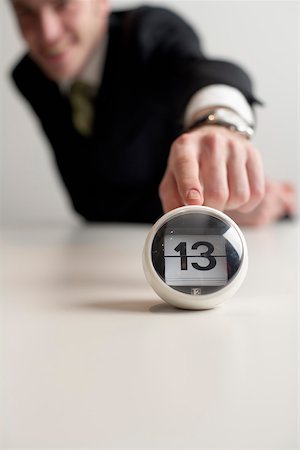 superstition - Businessman pointing on a date indicator Stock Photo - Premium Royalty-Free, Code: 628-01279383