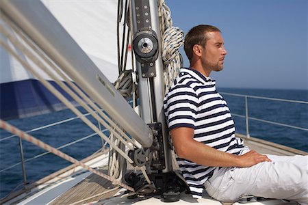 railing for decks ocean - Man sitting on a sailing yacht Stock Photo - Premium Royalty-Free, Code: 628-01495474