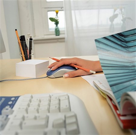 finger holding a key - Female hand on a mouse Stock Photo - Premium Royalty-Free, Code: 628-01712409