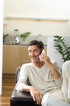 phone one person adult smile elderly - Mature man using a phone Stock Photo - Premium Royalty-Free, Code: 628-02615389