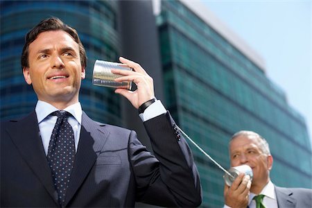 Two Businessmen with a tin can telephone Stock Photo - Premium Royalty-Free, Code: 628-02954108