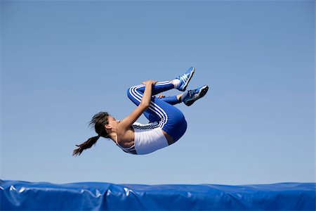 falling - Woman falling on safety mat Stock Photo - Premium Royalty-Free, Code: 628-02954398