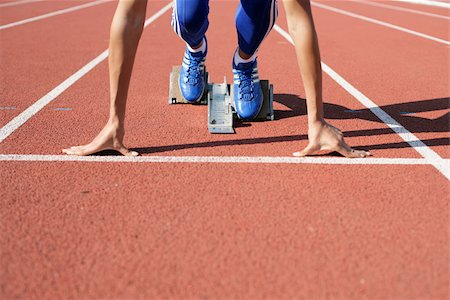 focused athlete starting - Femme en bloc de départ Photographie de stock - Premium Libres de Droits, Code: 628-02954408