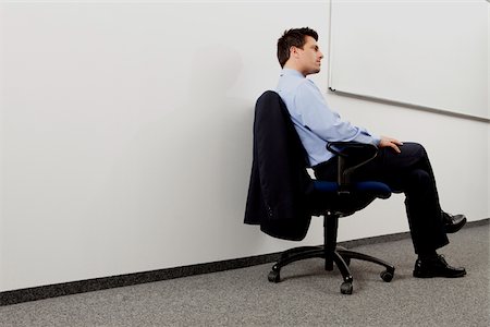 executive in the chair - Pensive businessman in office, Munich, Bavaria, Germany Stock Photo - Premium Royalty-Free, Code: 628-02953621