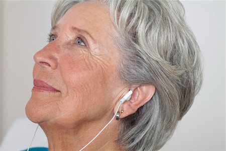 senior adult relaxing portrait not child - Senior woman listening to music Stock Photo - Premium Royalty-Free, Code: 628-03201140