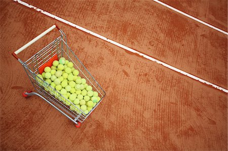 Trolley With Tennis Balls In Tennis Court Stock Photo - Premium Royalty-Free, Code: 622-05390908