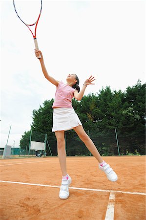 flexible young girls - Girl Playing Tennis Stock Photo - Premium Royalty-Free, Code: 622-05390927