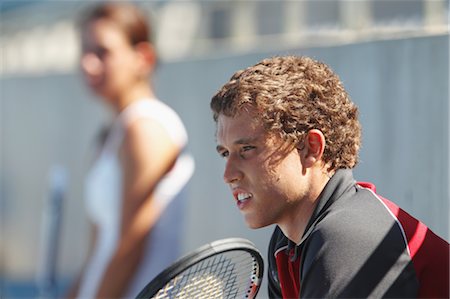 Young Male and Female Tennis Players Taking a Break Stock Photo - Premium Royalty-Free, Code: 622-05602757