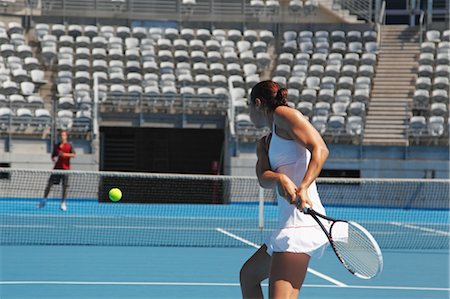 Young Male and Female Tennis Players Practicing Stock Photo - Premium Royalty-Free, Code: 622-05602807