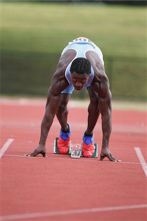 running track race - Runner at Starting Block Stock Photo - Premium Royalty-Free, Code: 622-05602847