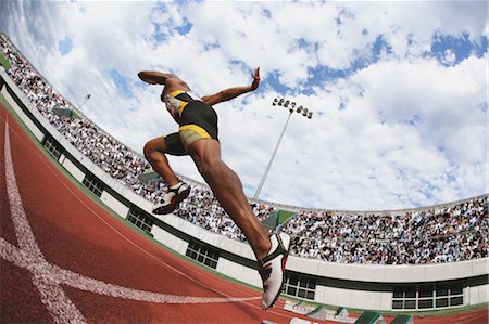 professional sports - Runner On Race Track Leaving Starting Point Stock Photo - Premium Royalty-Free, Code: 622-05602874