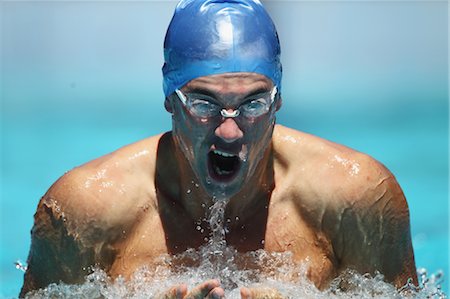 simsearch:858-06756400,k - Young Man Swimming Breaststroke, Close-Up Stock Photo - Premium Royalty-Free, Code: 622-05786799