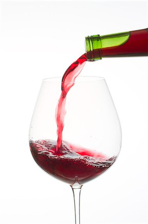 Red Wine Pouring Into Glass Stock Photo - Premium Royalty-Free, Code: 622-06009989