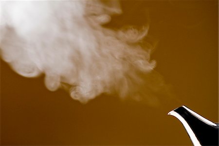 Smoke Emitting From Teapot Stock Photo - Premium Royalty-Free, Code: 622-06010017